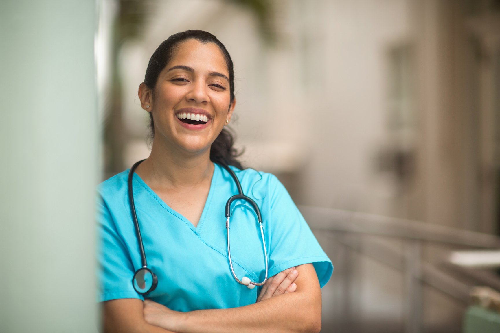 Confident hospital nurse smiling at work.